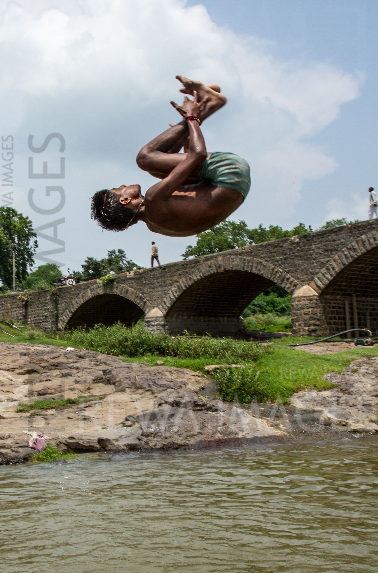Kids leaping into the river